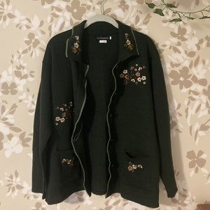 dark green button-up cardigan with white, and light brown embroidered flowers.